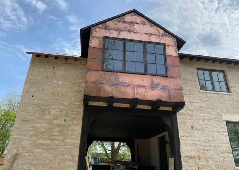 Copper metal panel facade on a stone building for Roof Repair in Nevada